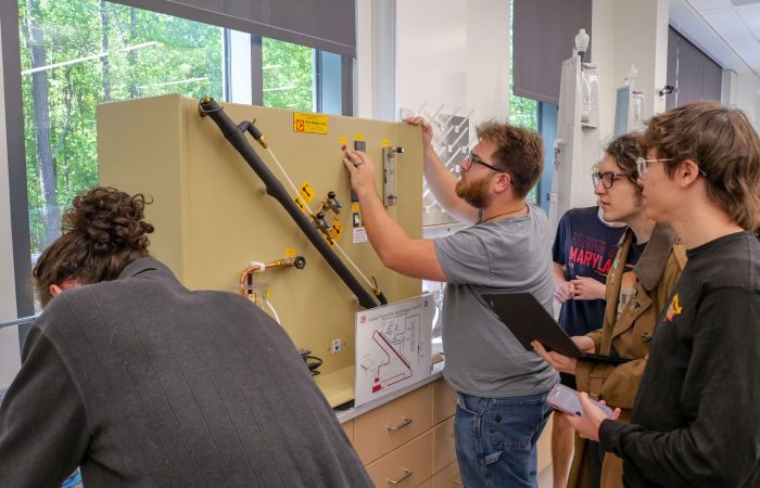 USMSM Students working with equipment on campus